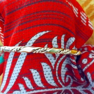 Twisted gold bangle bracelet